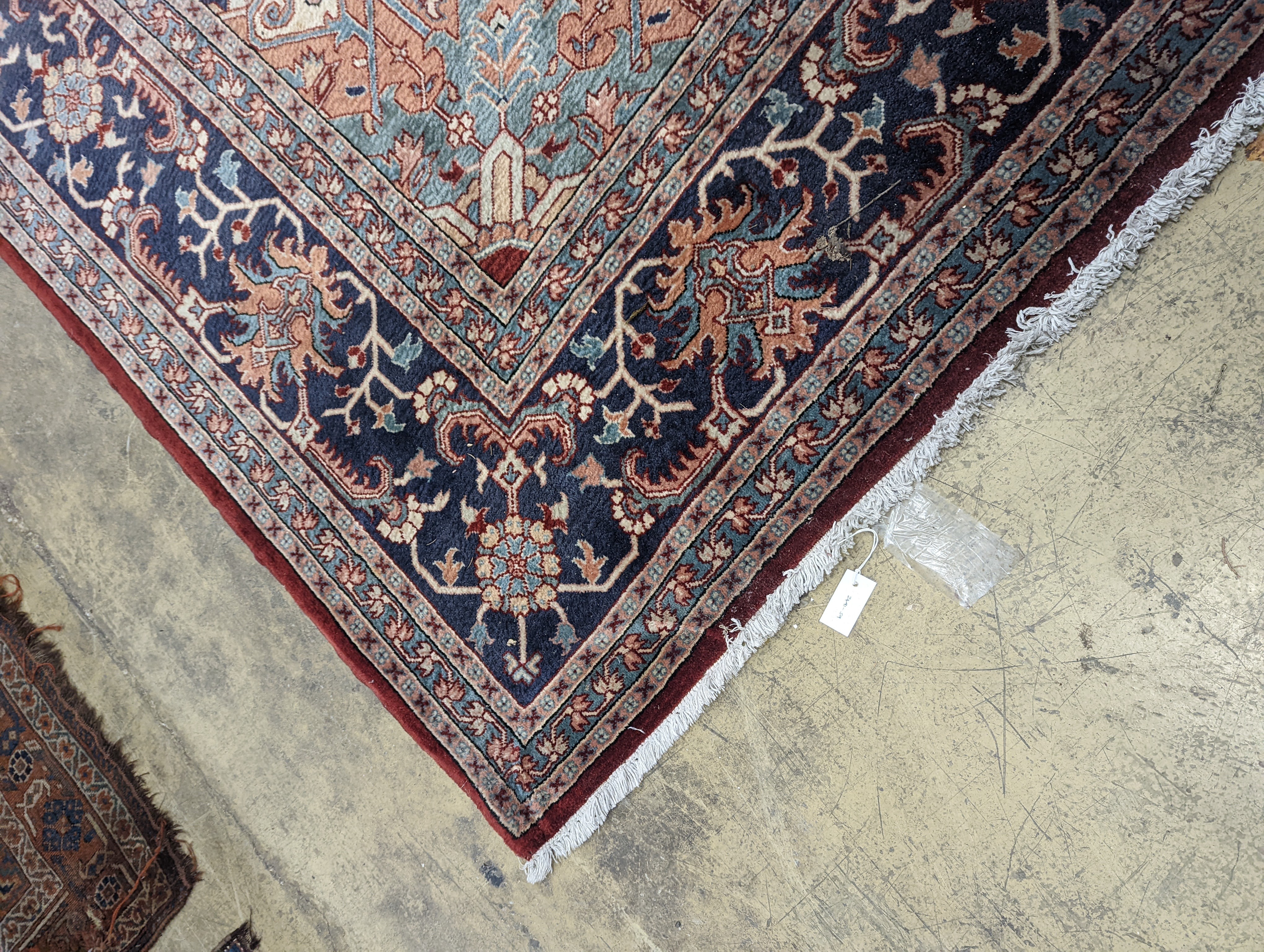 A large Caucasian style red ground carpet, 460 x 330cm